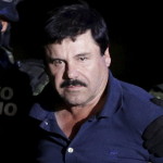 Recaptured drug lord Joaquin "El Chapo" Guzman is escorted by soldiers at the hangar belonging to the office of the Attorney General in Mexico City, Mexico January 8, 2016. Picture taken January 8, 2016. REUTERS/Henry Romero - RTX21OFZ